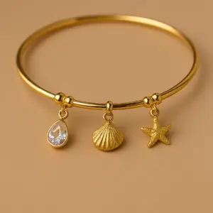 Golden Charm Bangle with Crystal & Ocean-Inspired Pendants