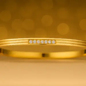 Sleek Gold-Plated Bangle with Diamond Accents